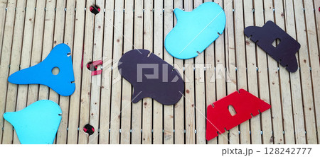 Colorful Wooden Playground Stepping Blocks on Cobblestone Street. Urban Outdoor Kids Game. Concept of child development, learning, in urban living conditions 128242777