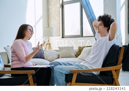 Young male patient talking to professional psychologist social worker counselor 128243141