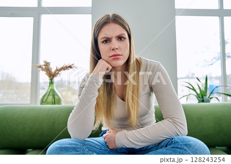 Web cam view of young serious woman talking looking in camera, online meeting, video call Web cam view of young serious woman talking looking in camera, online meeting, video call 128243254