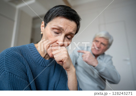 Senior family break. Distressed woman in depression learn about husband infidelity while he defends 128243271