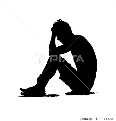 Silhouette of a person sitting with their head in their hand in distress. 128244428