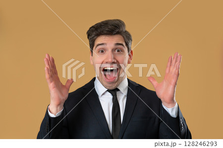 Handsome mature businessman reacts with amazed expression, says wow, open mouth Handsome mature businessman reacts with amazed expression, says wow, open mouth 128246293