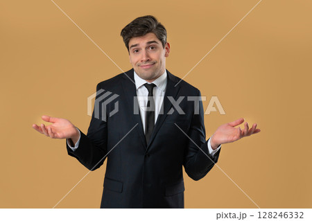 Businessman shrugs shoulders showing uncertainty, confusion, dilemma, hesitation 128246332