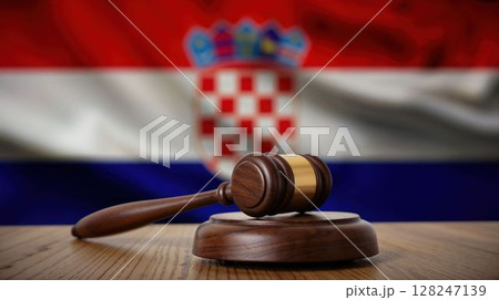 Wooden gavel on table with Croatian flag background 128247139
