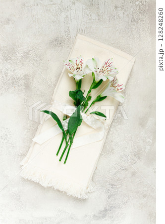 kitchen towels, cream color, with alstroemeria, Peruvian lily, top view, concept, decor, no people, 128248260