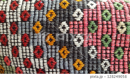 Weave texture of traditional Turkish ethnic pattern carpet closeup 128249058