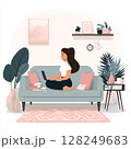 A modern freelance professional balances remote work and wellness in a cozy home setting. The image shows a person multitasking between yoga and answering emails, surrounded by everyday essentials. 128249683