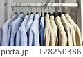 Jackets on hangers in a store on a neutral background 128250386