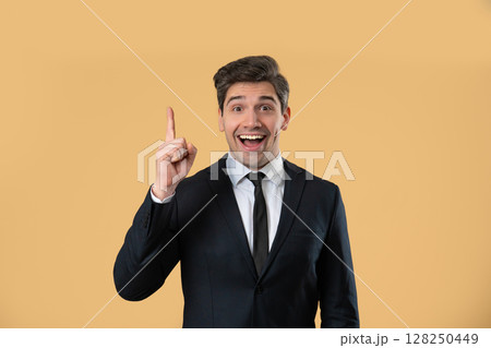 Genius Idea. Resourceful 30S Aged Businessman.eureka Moment,Pointing Finger Up Genius Idea. Resourceful 30S Aged Businessman.eureka Moment,Pointing Finger Up 128250449