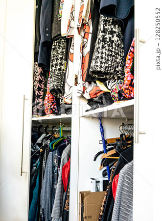 Closet Full of Clothes and Accessories Closet Full of Clothes and Accessories 128250552