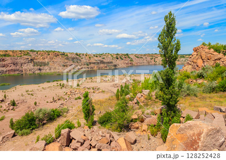 View of the lake at abandoned quarry on summer View of the lake at abandoned quarry on summer 128252428