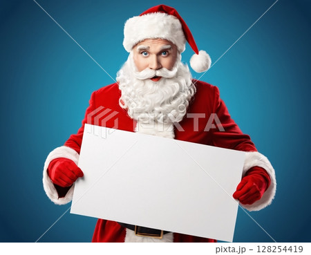 Portrait of santa claus holding blank sign on blue background.  128254419