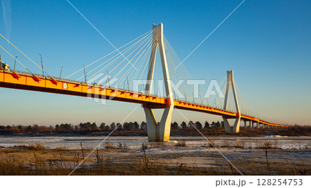 Winter view of cable bridge through Oka River. Russia Winter view of cable bridge through Oka River. Russia 128254753