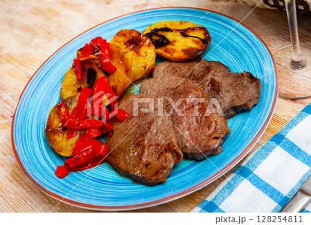 Tasty veal baked with potatoes and peppers served at plate Tasty veal baked with potatoes and peppers served at plate 128254811