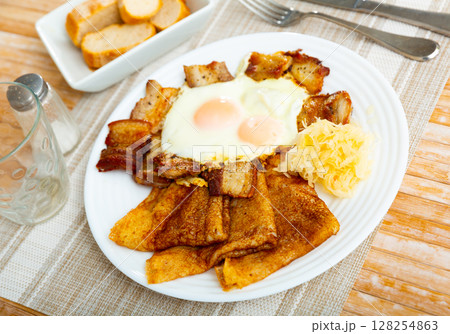 Pancakes with pork ham and fried eggs Pancakes with pork ham and fried eggs 128254863