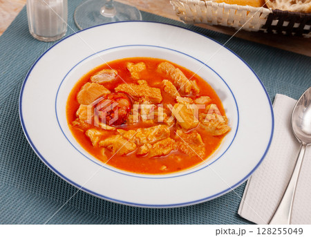 Soup from tasty boiled beef tripe with chorizo at plate Soup from tasty boiled beef tripe with chorizo at plate 128255049