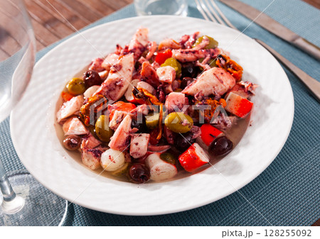 Delicious salad from variety of seafood with chopped vegetables (Salpicon de mariscos) typical for Spanish cuisine Delicious salad from variety of seafood with chopped vegetables (Salpicon de mariscos) typical for Spanish cuisine 128255092