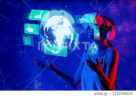 Woman in Virtual Reality Viewing Sustainable Technology Concepts for a Greener Future on Earth with Digital Environmental Graphics XDMCP 128256028
