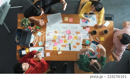 Top view of business team making scrum task board at meeting room. Convocation. Top view of business team making scrum task board at meeting room. Convocation. 128256161