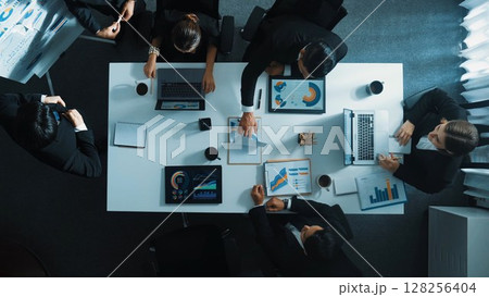 Top view of boss invites manager to explain about marketing plan. Directorate. 128256404