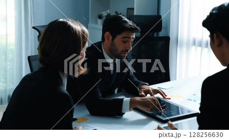 Back view of businessman work on laptop while team analysis data. Directorate. 128256630
