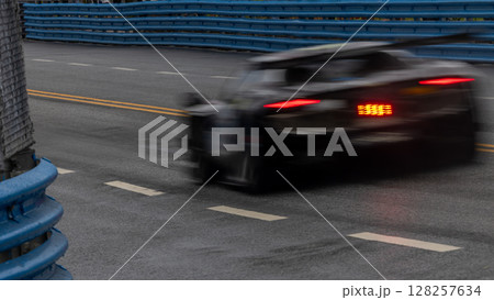Motion blur race car racing on speed track, Motion blurred super car race on street track circuit, Automobile automotive transportation vehicle background, Motion blur race car racing on speed track, Motion blurred super car race on street track circuit, Automobile automotive transportation vehicle background, 128257634
