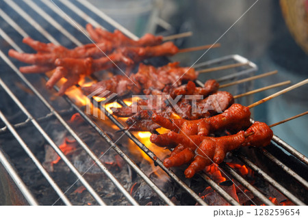 Grilled Chicken Feet on Skewers Traditional Filipino Street Food 128259654