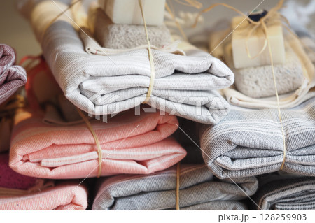 Soft textiles neatly arranged in a display for shoppers Soft textiles neatly arranged in a display for shoppers 128259903