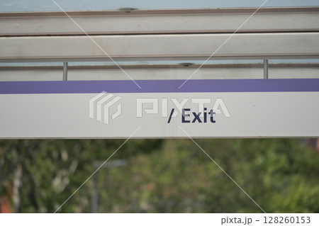 Sign indicating exit at a public transport station 128260153