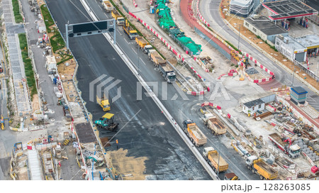 July 6 2025 Modern Road Construction Site with Heavy Machinery and Infrastructure Development 128263085