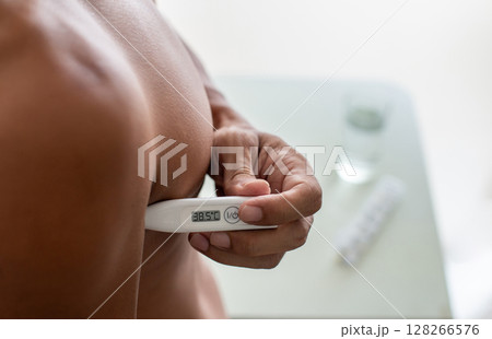 Man Self-Measuring Armpit Temperature at Home Man Self-Measuring Armpit Temperature at Home 128266576