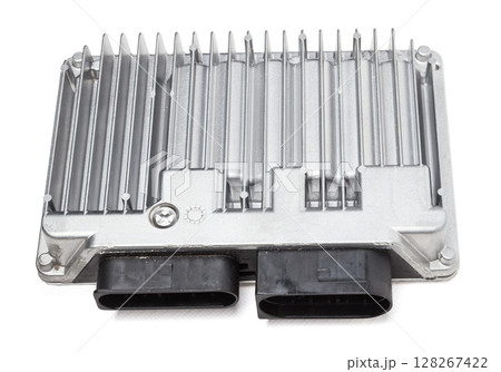 Metallic car engine control unit with plastic elements on a white isolated background is connecting center of various subsystems, units and assemblies. Monitoring the state of the moment. Spare part 128267422