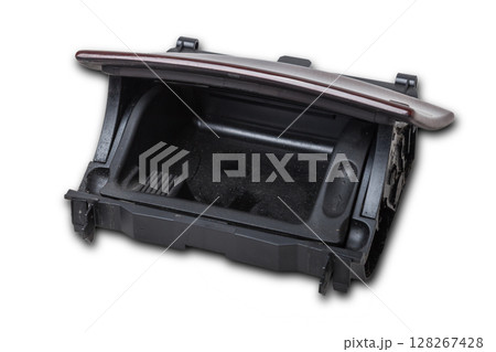An opened ashtray from panel of car interior separately on a white isolated background with wooden decorative overlay An opened ashtray from panel of car interior separately on a white isolated background with wooden decorative overlay 128267428