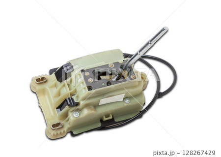 Spare part on a white isolated background in a photo studio for sale at an auto-parsing or replacement in a car service center - Automatic transmission selector gear lever with plastic elements. Spare part on a white isolated background in a photo studio for sale at an auto-parsing or replacement in a car service center - Automatic transmission selector gear lever with plastic elements. 128267429