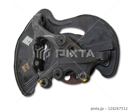 A close-up of a worn metal wheel hub with oil and rust elements on a white background. Seasonal undercarriage repair and replacement of brake system parts in a workshop. A close-up of a worn metal wheel hub with oil and rust elements on a white background. Seasonal undercarriage repair and replacement of brake system parts in a workshop. 128267512