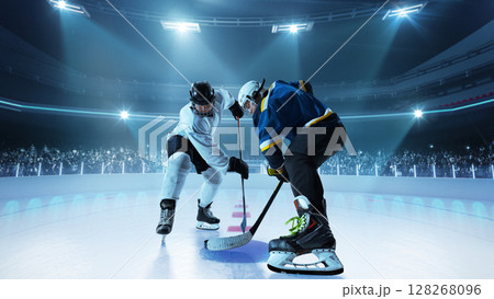 Ice hockey players ready for puck drop in competitive 3D arena 128268096