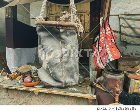 Rustic Leather Bag in Market Setting Rustic Leather Bag in Market Setting 128268288