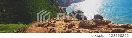 Rocky seascape. Region of Cape Roca, Atlantic Ocean, Portugal. Horizontal banner Rocky seascape. Region of Cape Roca, Atlantic Ocean, Portugal. Horizontal banner 128268296