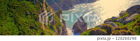Rocky seascape. Region of Cape Roca, Atlantic Ocean, Portugal. Horizontal banner 128268298