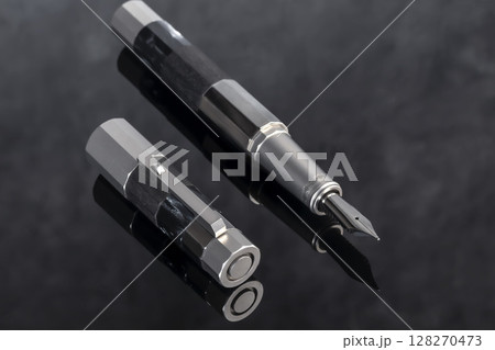 Branded pen with ink and nib in a box. Gift set. Office interior. 128270473
