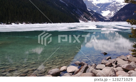 Thawing ice reveals clear lake Thawing ice reveals clear lake 128271029