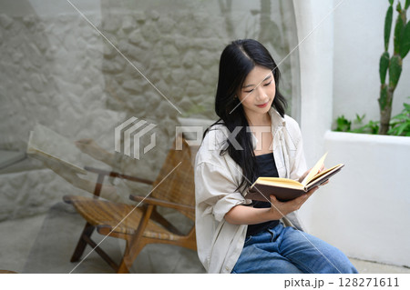 Relaxed female Relaxed female at outside a stylish modern cafe Relaxed female Relaxed female at outside a stylish modern cafe 128271611