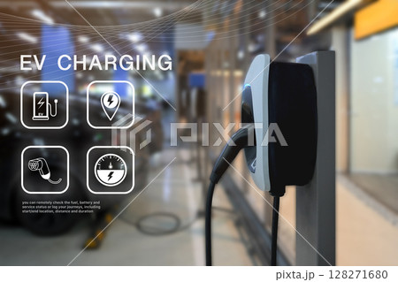 Electric vehicle charging station in focus with digital EV interface graphics overlaid Electric vehicle charging station in focus with digital EV interface graphics overlaid 128271680