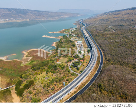 Drone shot aerial view landscape of the M6  motorway Expressway Nakhon Ratchasima Province - Bang Pa-in. Lam Ta Khong River and Mountain. Drone shot of scenic landscape rural place traffic. Nakhon 128272190