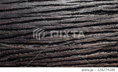 The of a macro photo of black wood surface with wood texture 128274186