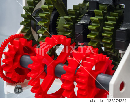 Colorful gears in a mechanical assembly showcase intricate design Colorful gears in a mechanical assembly showcase intricate design 128274221