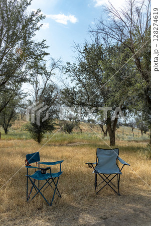 Two empty camping chairs. Outdoor furniture 128274619