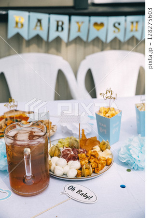 Celebratory table setting for a baby shower with food and drinks Celebratory table setting for a baby shower with food and drinks 128275603