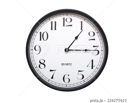 Round analog wall clock with a black frame, white face, and bold black numerals. showing 01:15 or 13:15. Isolated on a white background. Ideal for time-related themes. Round analog wall clock with a black frame, white face, and bold black numerals. showing 01:15 or 13:15. Isolated on a white background. Ideal for time-related themes. 128275923