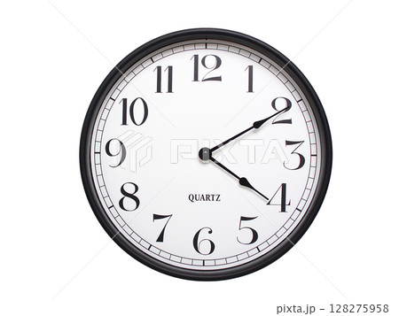 Round analog wall clock with a black frame, white face, and bold black numerals. showing 04:10 or 16:10. Isolated on a white background. Ideal for time-related themes. Round analog wall clock with a black frame, white face, and bold black numerals. showing 04:10 or 16:10. Isolated on a white background. Ideal for time-related themes. 128275958